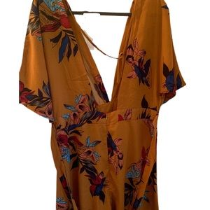 Burnt orange dress with flowers.